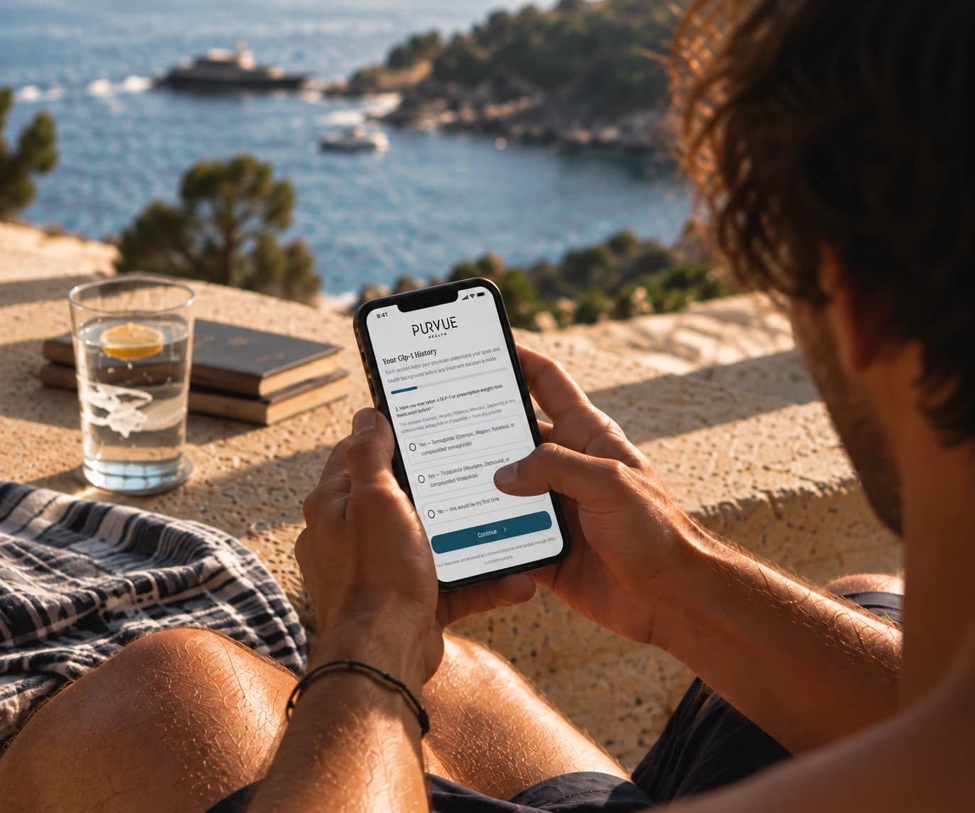 A man completing the PURVUE intake questionnaire on his phone above the coast