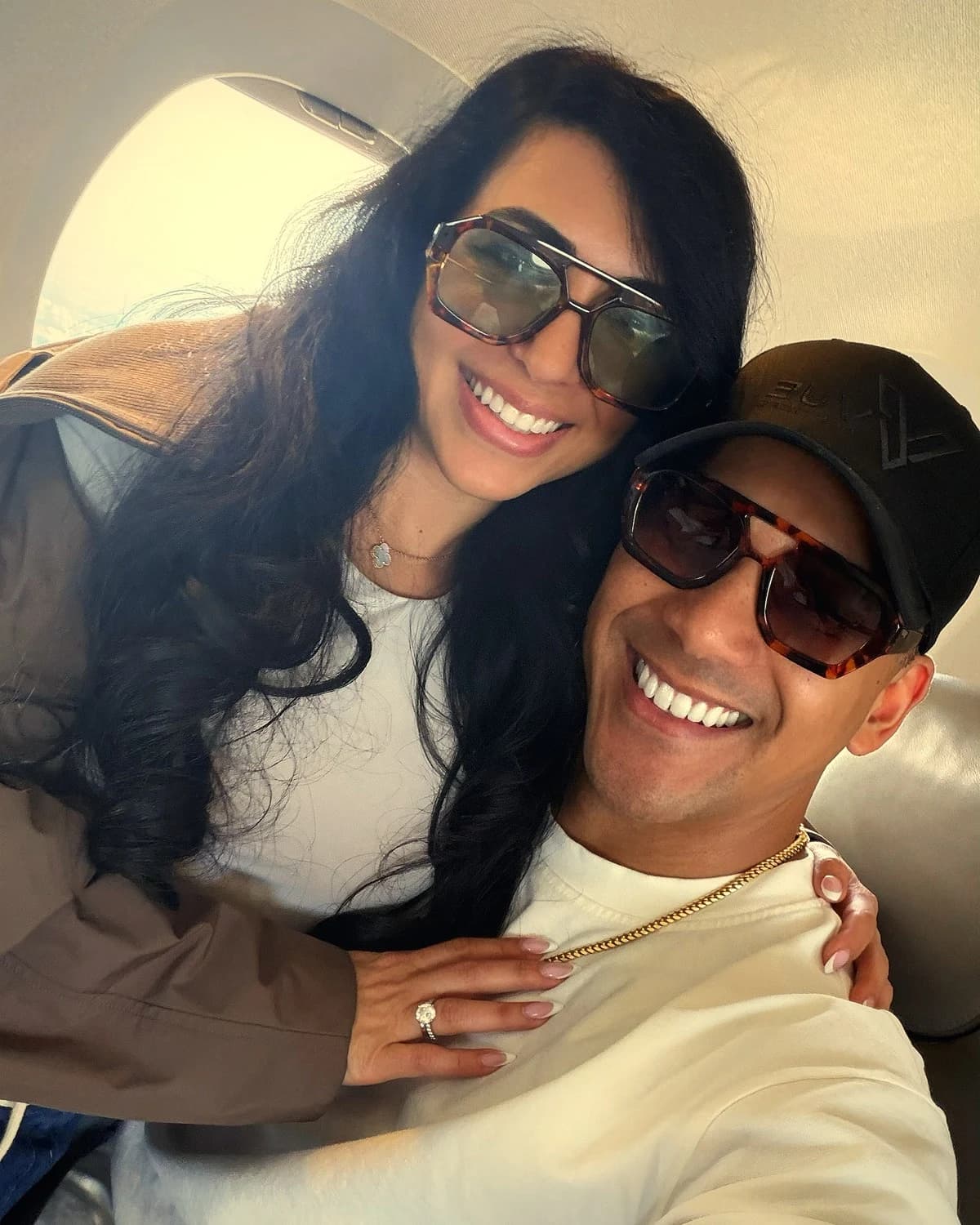 Douglas and Natalie Stapleton sharing a selfie aboard an airplane